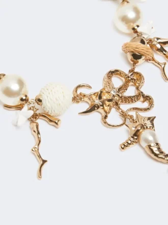 Collana girocollo “Abissi” in metallo e rafia, oro