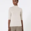 Maglione a collo alto in maglia rasata di lana, color cipria