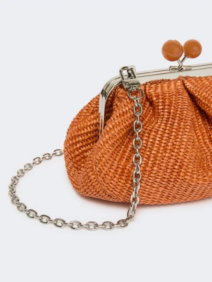 Piccola borsa a forma di pasticcino effetto rafia, color salmone Piccola borsa a forma di pasticcino effetto rafia, color salmone