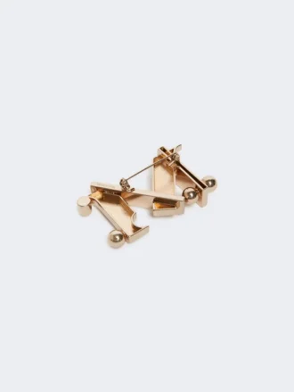 Spilla in metallo con monogramma, oro